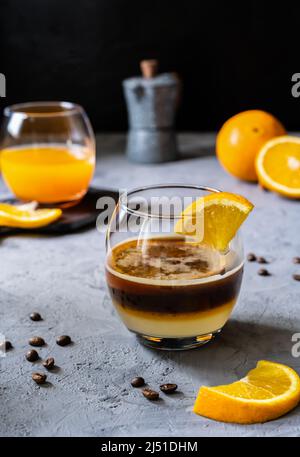 Coffee with orange juice and caramel syrup Stock Photo