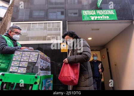 Vigo, pontevedra, spain - december, 17: woman buys lottery tickets at the stall at the temporary entrance of the Povisa hospital in Vigo Spain. Stock Photo