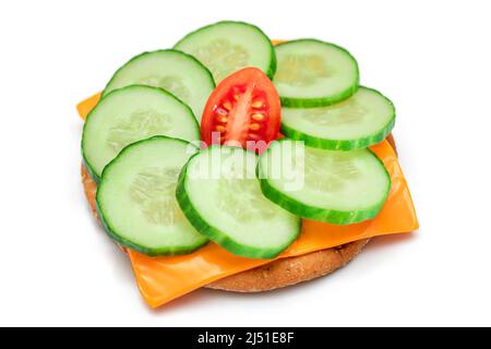 Crispy Cracker Sandwich with Fresh Cucumber, Tomato Cherry and Cheese - Isolated on White. Easy Breakfast. Quick and Healthy Sandwich. Crispbread with Tasty Filling. Healthy Dietary Snack - Isolation Stock Photo