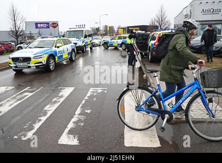 Three policemen were taken to hospital and two people have been arrested in connection with a violent riot in the Linköping district Skäggetorp, where the right-wing extremist Stram kurs (In english: Stram course) had planned a demonstration. The picture shows the police meeting point some distance from the area. Stock Photo