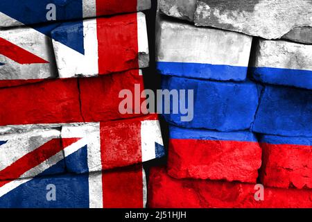 Concept of the relationship between United Kingdom and Russia with two painted flags on a damaged brick wall Stock Photo