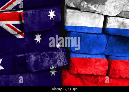 Concept of the relationship between Australia and Russia with two painted flags on a damaged brick wall Stock Photo