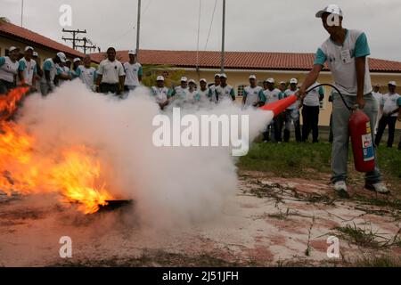 porto seguro, bahia, brazil - november 3, 2010: person puts out fire during firefighting training in Porto Seguro city. Stock Photo