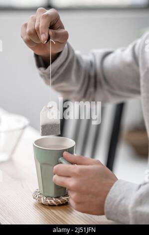 A man spending morning at home and preparing tea Stock Photo