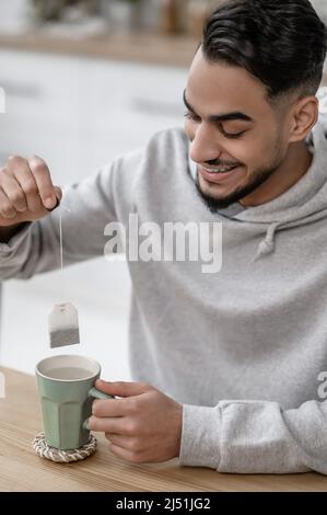 A man spending morning at home and preparing tea Stock Photo