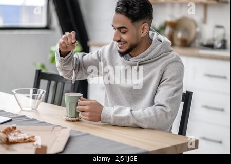 A man spending morning at home and preparing tea Stock Photo