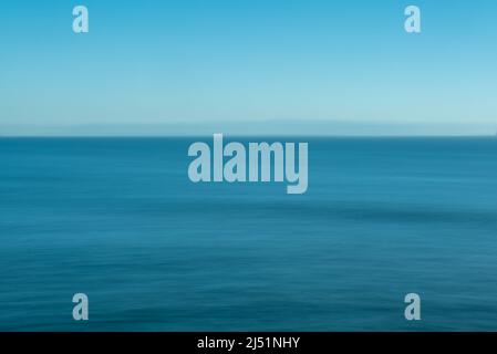 Impressionist rendering of the ocean at the Wilder Ranch State Park, California, USA, featuring shades of blue between the ocean and the sky Stock Photo