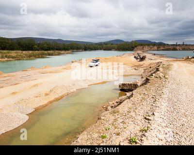 4x4 Offroad vehicle (SUV) at a lake side in the mountains Stock Photo