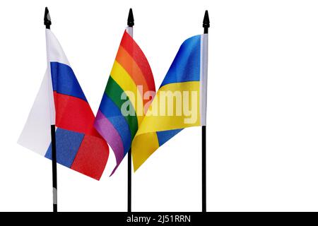 Close up of three flags of Russian of Ukrainian and in between rainbow colored colorful peace flag on white background as concept for peace negotiatio Stock Photo