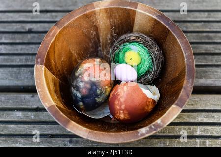 Selective focus photo. Bowl with painted eggs. Stock Photo