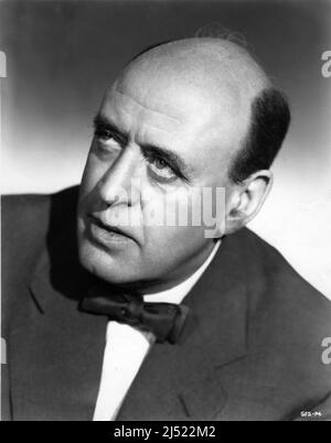 ALASTAIR SIM Portrait in THE GREEN MAN 1956 directors ROBERT DAY and BASIL DEARDEN play / screenplay / producers Sidney Gilliat and Frank Launder Grenadier Films Ltd. / British Lion Films Stock Photo