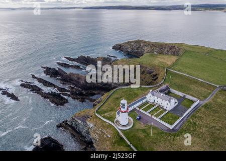 Galley Head, West Cork, Ireland. 19th Apr, 2022. Galley Head Lighthouse sits atop the coast in West Cork on a day of sunshine and showers. It will become drier this evening with highs of 10-13C. Credit: AG News/Alamy Live News Stock Photo