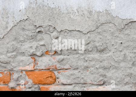 Damaged brick structural concrete plaster wal Stock Photo
