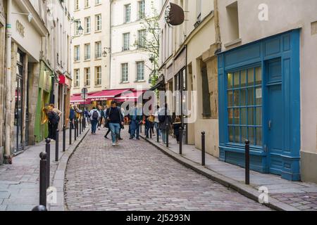 Paris, France. 13th Apr, 2022. Tourists walk down Rue Galande in the Sorbonne neighborhood in the 5th arrondissement of Paris. Rue Galande, today retains a medieval appearance, it was once the Roman road that went to Lyon and Rome, it is a very touristic place. (Credit Image: © Atilano Garcia/SOPA Images via ZUMA Press Wire) Stock Photo