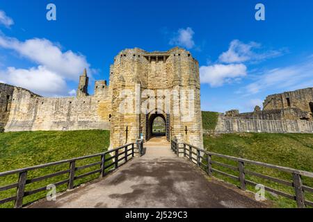 The bridge and entrance gate to Warkworth Castle, Northumberland, England Stock Photo