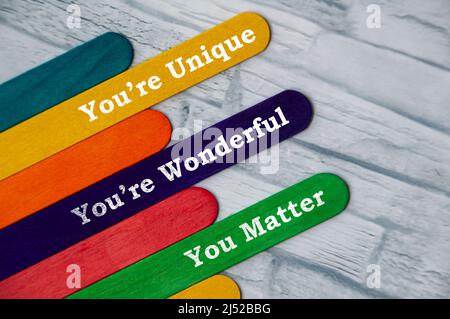 Motivational quote text on colorful wooden stick. Motivational concept Stock Photo