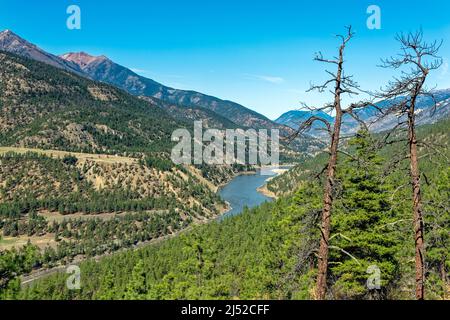 Trees surround the Fraser River near Lillooet in British Columbia, Canada Stock Photo