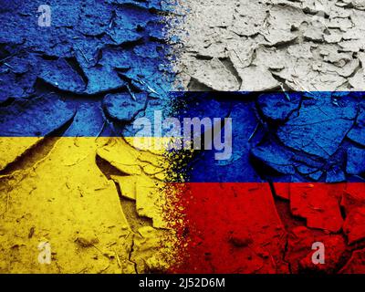 Russia vs Ukraine national flags pattern on grungy dry cracking earth Stock Photo