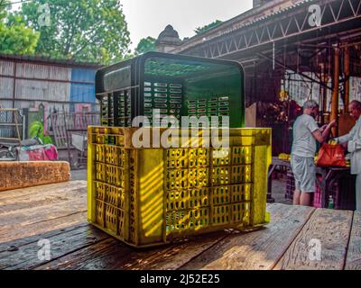 04 10 2022 Empty stacks of colorful plastic crates in a farmers produce market Pune Maharashtra India Stock Photo