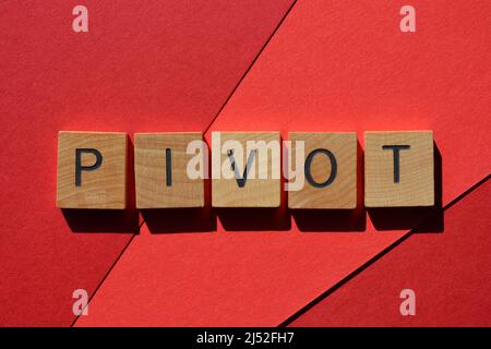 Pivot, word in wooden alphabet letters isolated on wood background ...