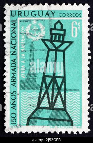 URUGUAY - CIRCA 1968: a stamp printed in the Uruguay shows Lighthouse and Buoy, Sesquicentennial of National Navy, circa 1968 Stock Photo