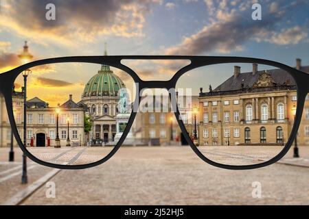 Clear image in glasses against blurry landscape. Stock Photo