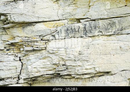 abstract limestone texture, relief of natural limestone rock with layers and cracks Stock Photo