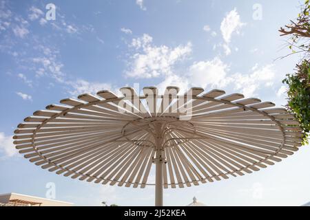 Hurghada, Egypt - October 1, 2019: sunshade umbrellas and sunbeds near pool in Jaz Casa Del Mar Resort in Hurghada, Egypt Stock Photo