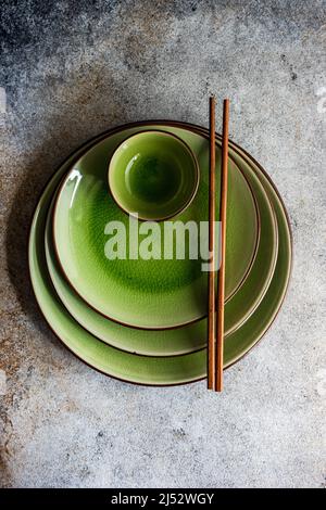 Overhead view of green spring Asian place setting with chopsticks Stock Photo