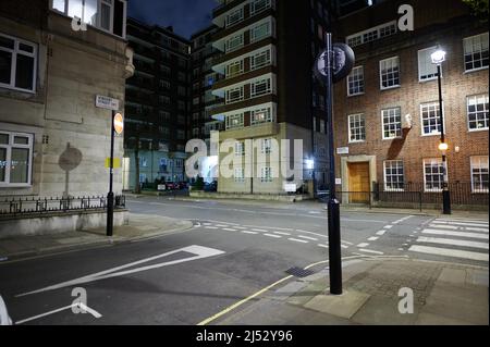 13 april 2022 - londonuk : Street scene in london of zebra pedestrian crossing and t junction with large apartment buildings in background and no peo Stock Photo
