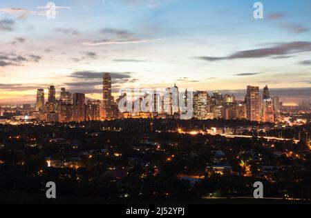 Manila City aerial view at sunset. Capital of Manila
