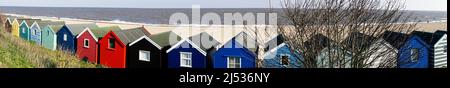 panoramic row of beach and beach huts in winter southwold suffolk england Stock Photo