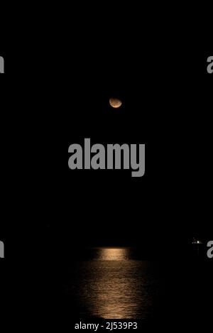 reflections with the moon on the atlantic ocean Stock Photo