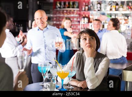 Bored woman at party Stock Photo