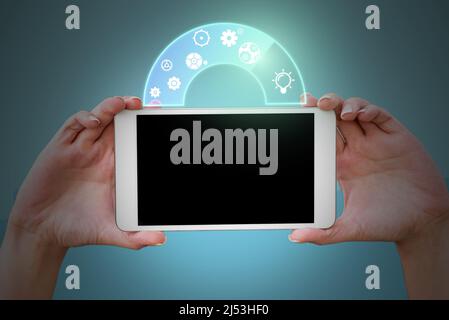 Hands holding tablet presenting innovative ideas symbolizing futuristic technology. Palms carrying electricall device displays successful creative Stock Photo