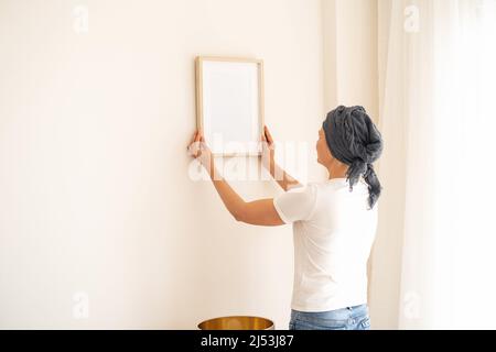 A wooden frame with empty space in women's hands Stock Photo