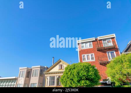 Residential buildings in a low angle view against the clear sky in San Francisco, California Stock Photo