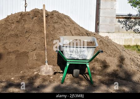 Spring garden work, soil improvement work, replenishing the fertile layer Stock Photo