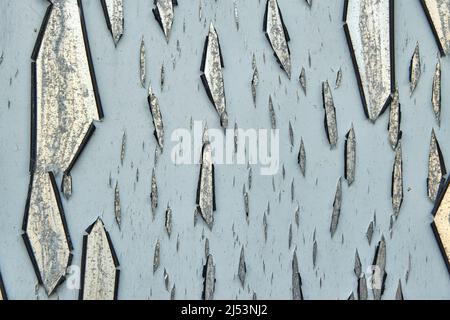 Close up of paint peeling off of a metal surface Stock Photo
