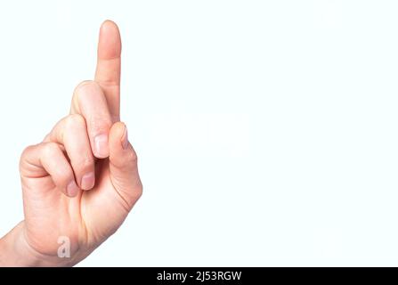 Banner with man index finger raised upwards. Gesture showing number one. Copy space. High quality photo Stock Photo