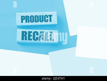 Product Recall written on a wooden blocks on red. Business concept. Warranty and quality control. Stock Photo