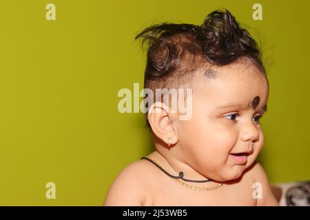 Close-up portrait photo of A lovely cute little Indian hindu baby boy without clothes with smiling face, india Stock Photo