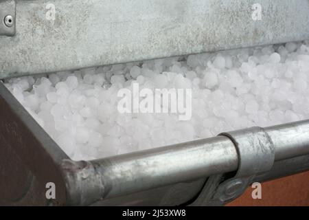 Hailstones in gutter Stock Photo