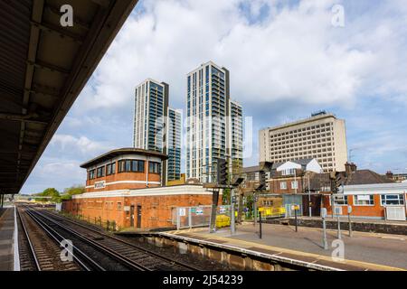 The recently completed mixed use tall tower block development at Victoria Square, Woking town centre, Surrey, seen from Woking station with signal box Stock Photo