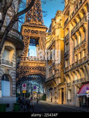 Paris, France - February 7, 2022: Eiffel tower between haussman buildings in Paris Stock Photo