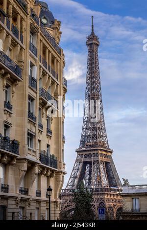 Paris, France - December 11, 2021: Nice view of Eiffel tower with Haussmann building in Paris Stock Photo