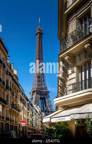 Paris, France - May 27, 2021: Eiffel tower between haussman buildings in Paris Stock Photo