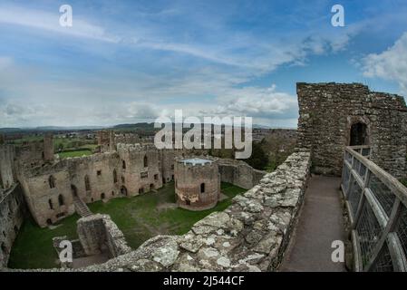 Ludlow Castle is a ruined medieval fortification built in the 11th century in Ludlow in the English county of Shropshire, overlooking the River Teme. Stock Photo