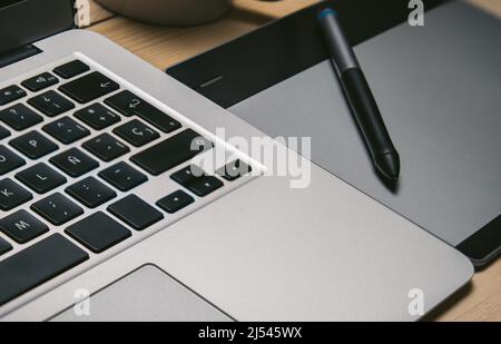Graphic tablet and pencil on office desk. Tool design graphic Stock Photo