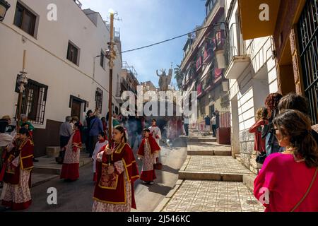 Almunecar, Spain. 17th April 2022. Easter Holy Week, Semana Santa,  in Almuñécar, declared of National Tourist Interest in Andalusia, fills the streets of the municipality with tradition and heartfelt devotion each year. This is the Easter Sunday procession the final day of Holy Week. It commemorates the Catholic festival of the Resurrection of Jesus Christ. brotherhoods organize the processions that go through the streets and squares carrying beautiful thrones adorned with flowers and religious images that are carried by the forks. Credit David Smith/Alamy Live News Stock Photo